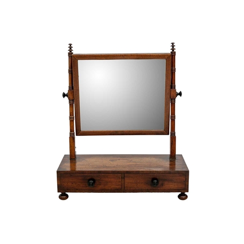 607 - A George IV mahogany rectangular swing toilet mirror. The base fitted two drawers, on bun feet, heig... 