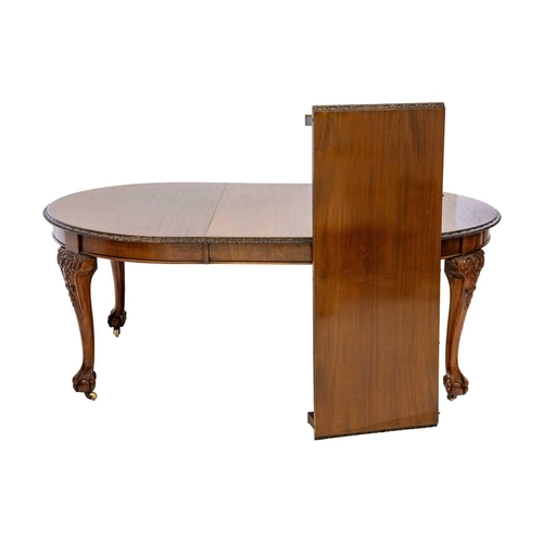 616 - A Victorian mahogany extending dining table. With D ends on ball and claw feet and castor wheels, tw... 