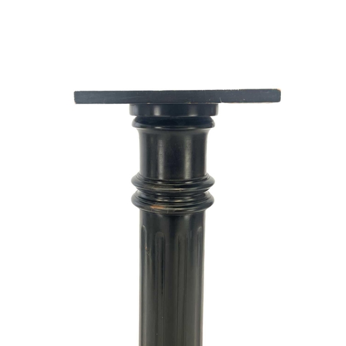 623 - An Edwardian ebonised pillar or torchere. With fluted column, height 106cm, together with a tripod w... 