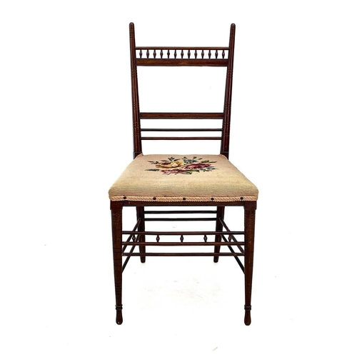 626 - A mahogany side chair in the Anglo-Japanese taste. Circa 1890, in the E.W. Godwin manner, with rail ... 