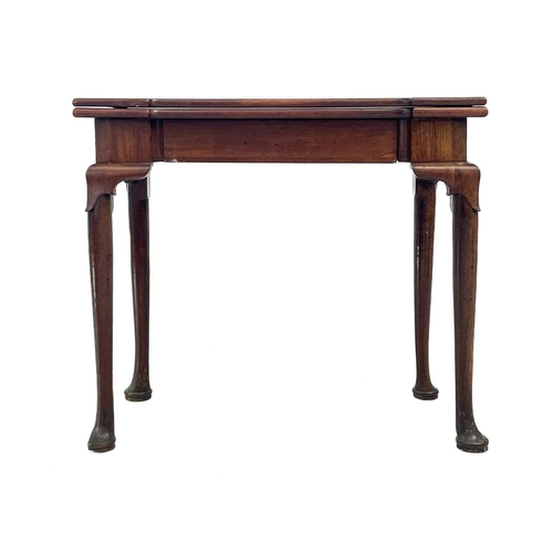 633 - An early George III mahogany fold top tea table. With angled protruding corners and fitted a frieze ... 