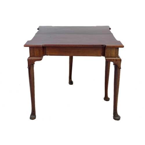 633 - An early George III mahogany fold top tea table. With angled protruding corners and fitted a frieze ... 