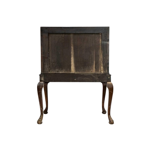 635 - An early 20th Century walnut bureau. Sloped full front revealing an arrangement of drawers and pigeo... 