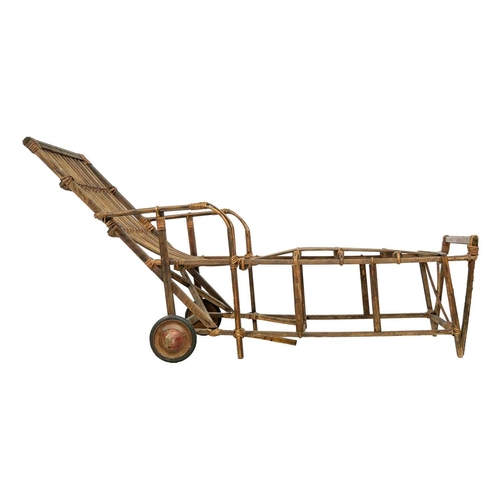 639 - A bentwood and rattan lounger. Fitted with two wheels, height 89cm, length 179cm, width 61cm.