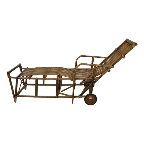 639 - A bentwood and rattan lounger. Fitted with two wheels, height 89cm, length 179cm, width 61cm.