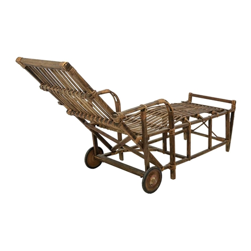 639 - A bentwood and rattan lounger. Fitted with two wheels, height 89cm, length 179cm, width 61cm.