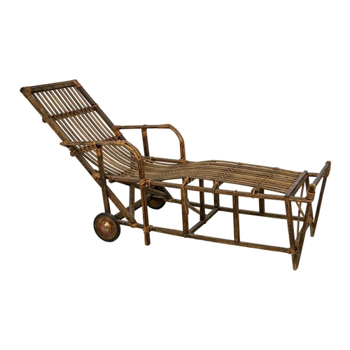 639 - A bentwood and rattan lounger. Fitted with two wheels, height 89cm, length 179cm, width 61cm.