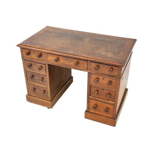 642 - A Victorian mahogany pedestal desk. With an arrangement of nine drawers and an inset tooled leather ... 