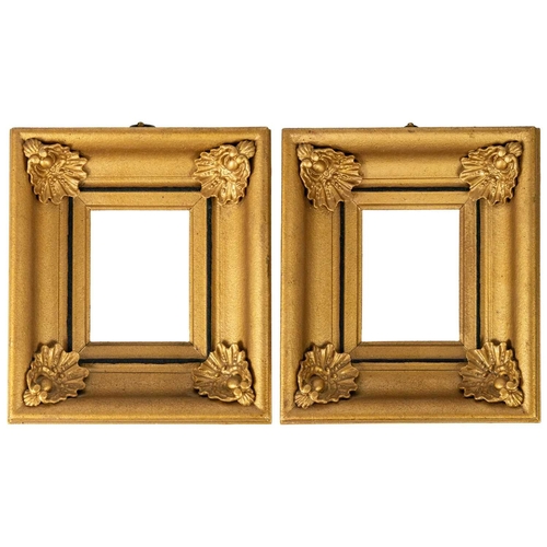 65 - A pair of Victorian gilt gesso rectangular frames. The angles with applied shells, 23.5X20.5 overall... 