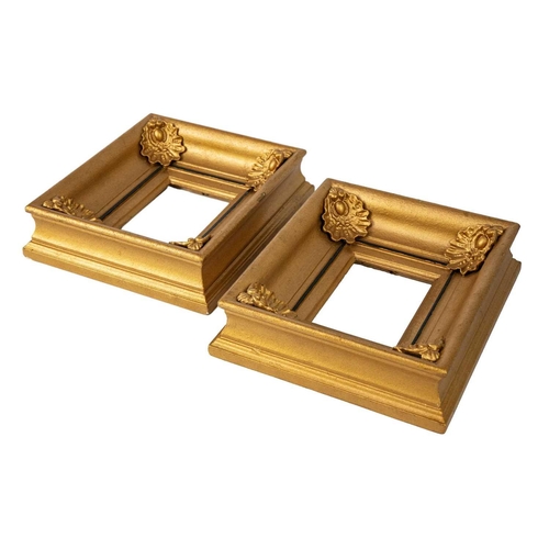 65 - A pair of Victorian gilt gesso rectangular frames. The angles with applied shells, 23.5X20.5 overall... 