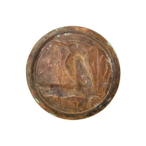 68 - An Arts and Crafts copper dish Decorated in repousse and chased with a perched Kingfisher, stamped H... 