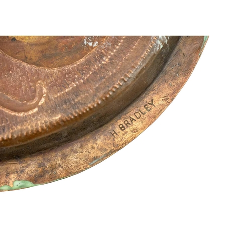 68 - An Arts and Crafts copper dish Decorated in repousse and chased with a perched Kingfisher, stamped H... 