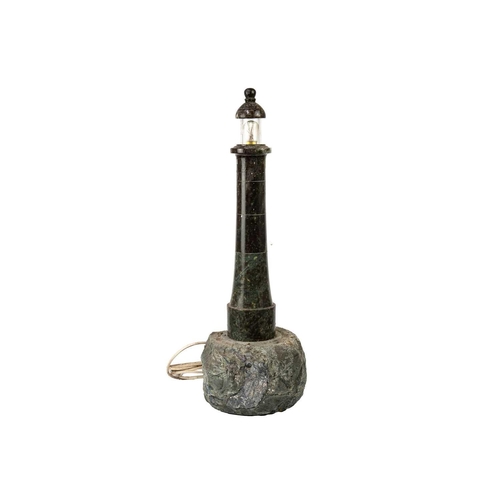 70 - A Cornish turned serpentine lighthouse table lamp. With glazed top, banded body, and rockwork base, ... 