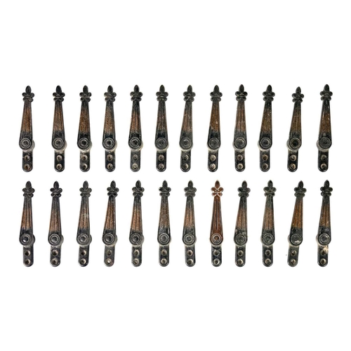 76 - A set of twenty-four early 20th century copper plated stair carpet grips of fleur-de-lys design. Wit... 