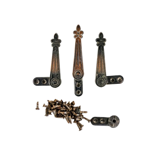 76 - A set of twenty-four early 20th century copper plated stair carpet grips of fleur-de-lys design. Wit... 