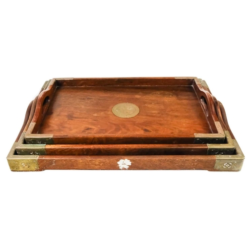 90 - A set of three graduated Chinese hardwood and brass trays. The largest 50.5cm x 35.5cm.