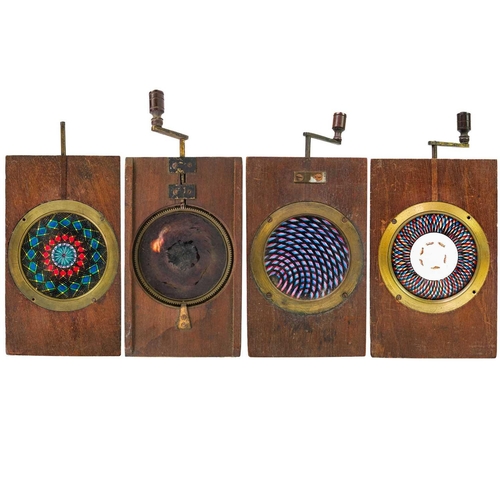 99 - A set of three mechanical chromotrope double rackwork magic lantern slides. Together with a single r... 