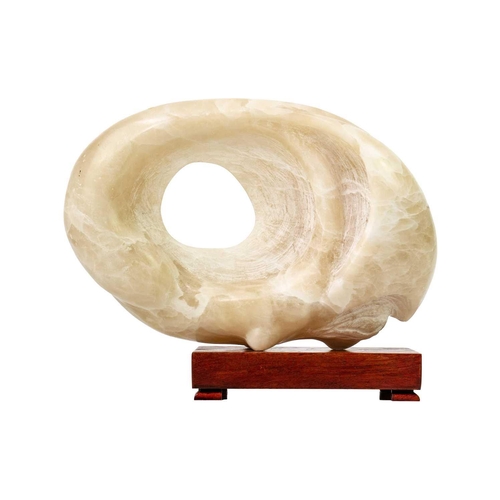 323 - Max BARRETT (1937-1988) Untitled Alabaster form with wooden stand, height 28cm, width 32cm.