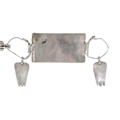 102 - An Omani silver rectangular amulet with chain. Total length 84cm, amulet 8.5 x 4.5cm.