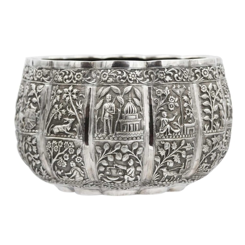 105 - A Burmese silver thabeik lobed bowl, early 20th century. Of lobed form, with twenty-four panels repo... 