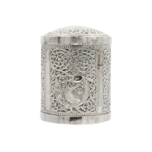 112 - An Indian silver cannister, early 20th century. The cover repousse decorated with an elphant within ... 