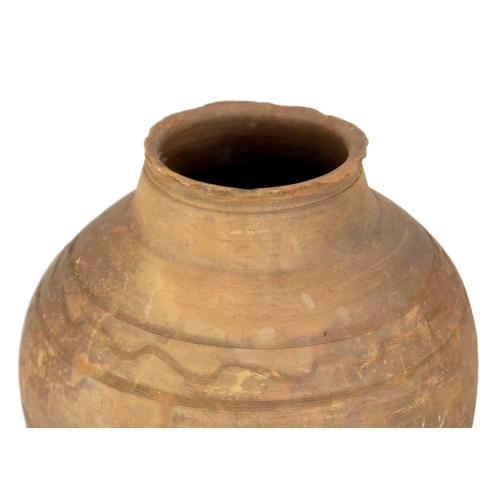 119 - A terracotta olive jar on metal stand. Height 81cm, width 39cm.