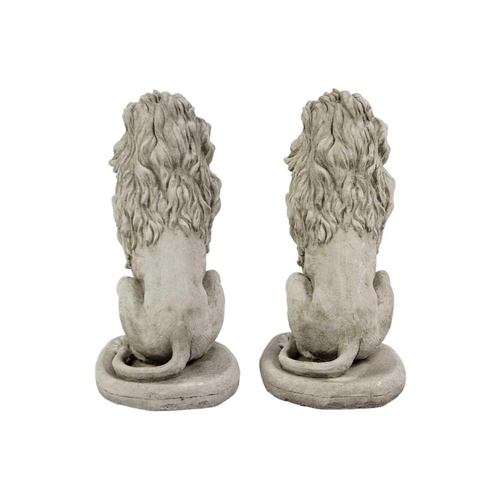 125 - A pair of reconstituted stone garden ornaments in the form of lions. Height 41cm, width 20cm, depth ... 