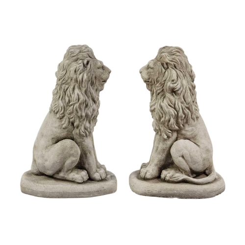 125 - A pair of reconstituted stone garden ornaments in the form of lions. Height 41cm, width 20cm, depth ... 