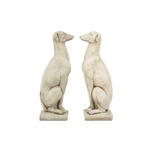 126 - A pair of reconstituted stone garden ornaments in the form of whippets. Height 56cm, width 14.5cm, d... 