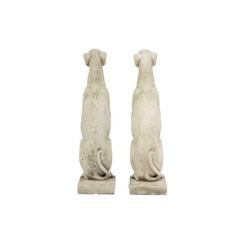 126 - A pair of reconstituted stone garden ornaments in the form of whippets. Height 56cm, width 14.5cm, d... 