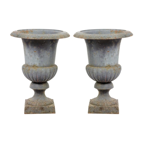 127 - A pair of cast iron campana shaped garden urns, 20th century. Height 45cm, width 33cm.(2)