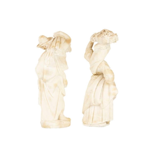 128 - A pair of Italian alabaster figures, 19th century. 'The Harvest', height 43cm. (2)