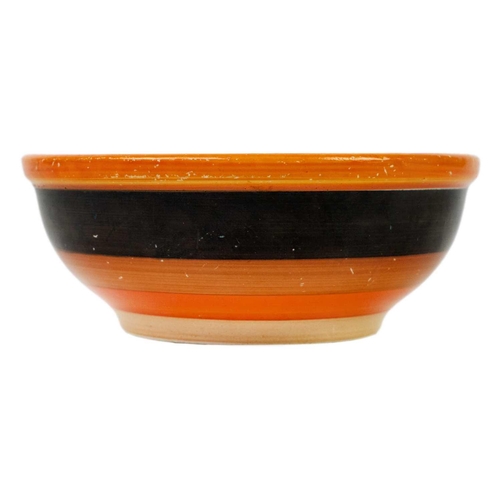 135 - A Clarice Cliff Banded shallow bowl with a heavy rim. The base with black overpaint with a patch rev... 