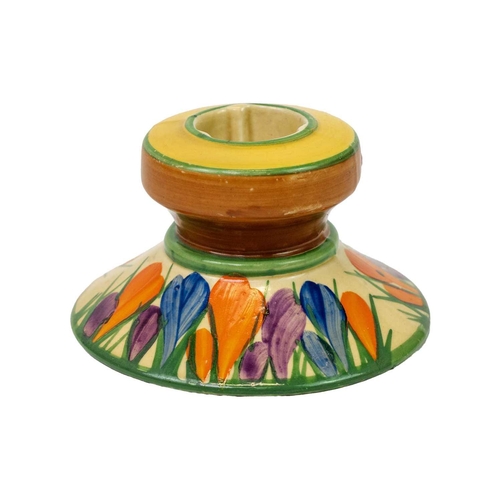 140 - A Clarice Cliff Crocus pattern shape 331 candlestick. Bizarre Newport Pottery mark, height 5.5cm.