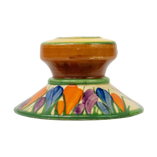 140 - A Clarice Cliff Crocus pattern shape 331 candlestick. Bizarre Newport Pottery mark, height 5.5cm.