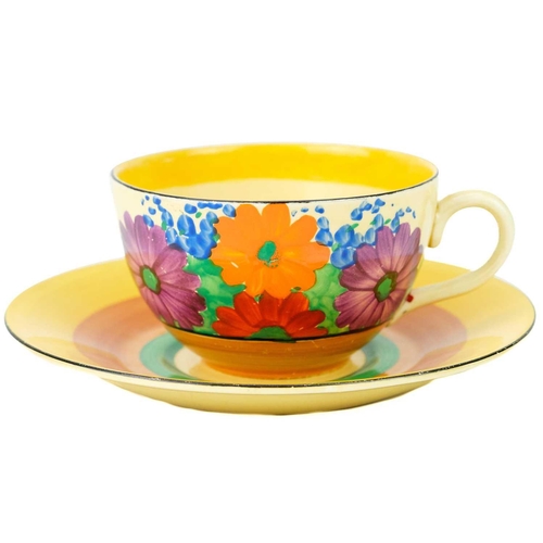 142 - A Clarice Cliff Gay Day pattern tea cup and saucer. The tea cup with Bizarre Wilkinson Ltd marks the... 