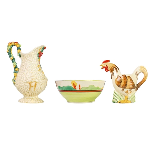 149 - A Clarice Cliff novelty cockerel teapot. Newport Pottery marks, together with a Celtic Harvest jug a... 