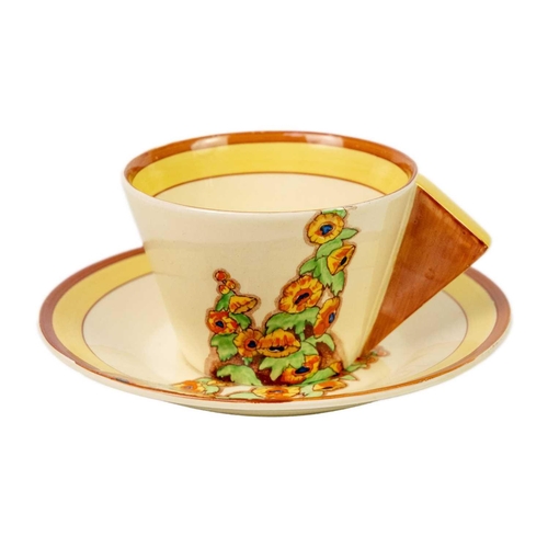 155 - A Clarice Cliff Sunshine pattern conical shape tea cup and saucer. Bizarre Wilkinson Ltd marks, toge... 