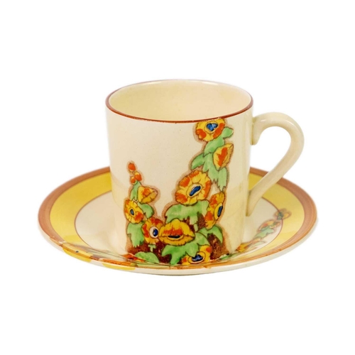 155 - A Clarice Cliff Sunshine pattern conical shape tea cup and saucer. Bizarre Wilkinson Ltd marks, toge... 