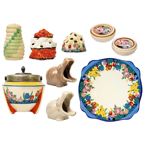 160 - A collection of various Clarice Cliff. Including a Raffia sugar sifter, two Mr Hippo pipe rests, a C... 