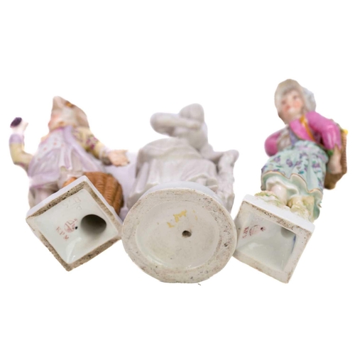 180 - A pair of Berlin K.P.M figures of fruit pickers. Height 15.5cm together with a continental porcelain... 