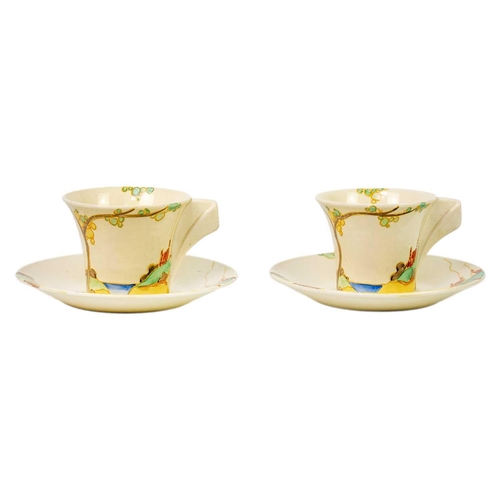 182 - A pair of Clarice Cliff Secrets pattern Daffodil shape tea cups and saucers. Bizarre Newport Pottery... 