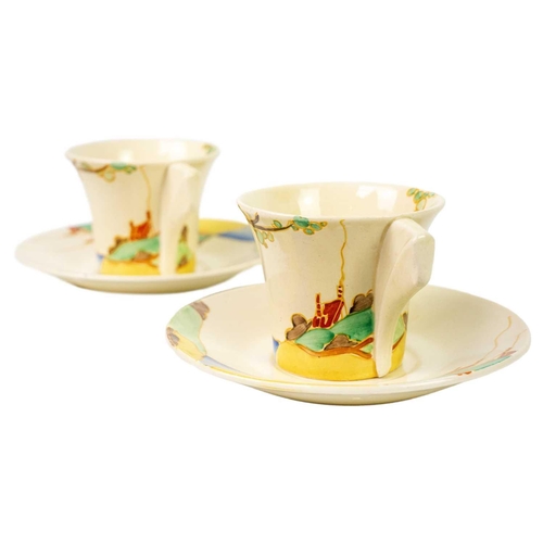 182 - A pair of Clarice Cliff Secrets pattern Daffodil shape tea cups and saucers. Bizarre Newport Pottery... 