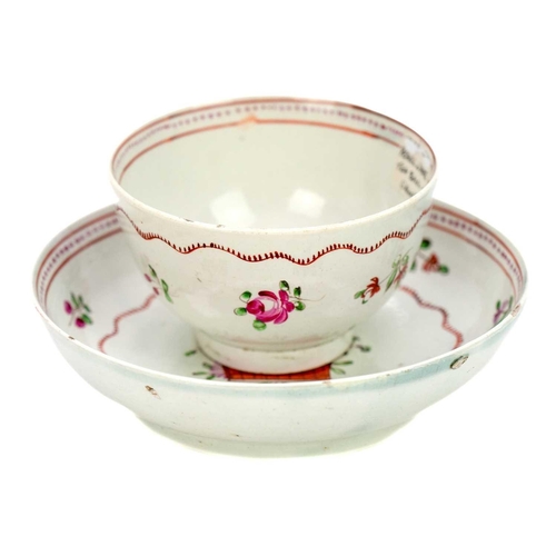 206 - An unusual 18th century English porcelain tea bowl. Decorated in puce with flower sprays the body wi... 