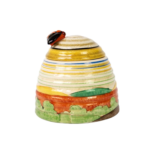 207 - An unusual Clarice Cliff Orange Cottage Roof pattern beehive honeypot. Also with banded decoration, ... 