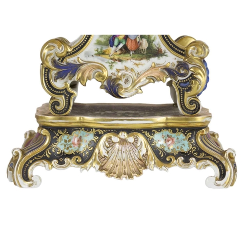 232 - A Paris porcelain mantel clock, 19th century. On stand, height 50cm, width 28.5cm.