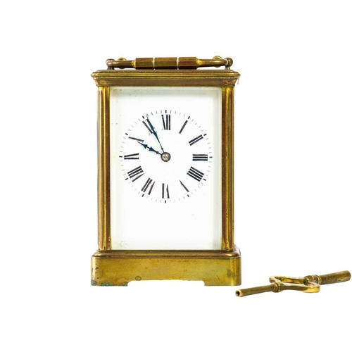 237 - A French brass carriage clock. Striking on a gong, with winding key, height 17cm.