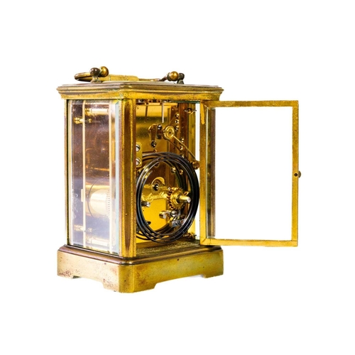 237 - A French brass carriage clock. Striking on a gong, with winding key, height 17cm.