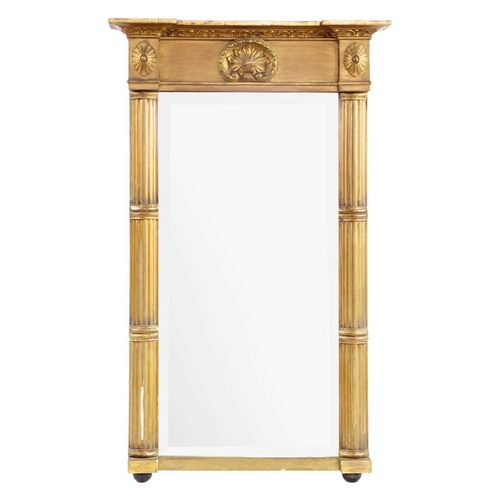 240 - A Regency giltwood wall mirror. The rectangular bevelled plate flanked by fluted columns, height 75c... 