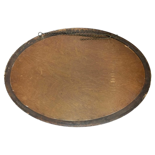 249 - An Edwardian Chinoiserie lacquered oval wall mirror. 85cmx 58cm.